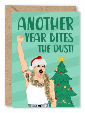A stripey light green Christmas card featuring Queen frontman Freddie Mercury next to a Christmas tree wearing tinsel around his neck and a Santa hat alongside white text reading ‘Another year bites the dust’