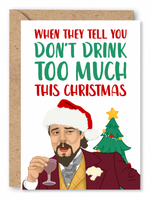 A white Christmas card featuring the Leonardo Dicaprio ‘Django Unchained’ meme wearing a Santa hat with a Christmas tree in the background alongside red and green text reading ‘When they tell you don’t drink too much this Christmas’