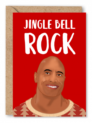 A red Christmas card featuring Dwayne ‘The Rock’ Johnson wearing a Christmas jumper alongside white text reading ‘Jingle Bell Rock’