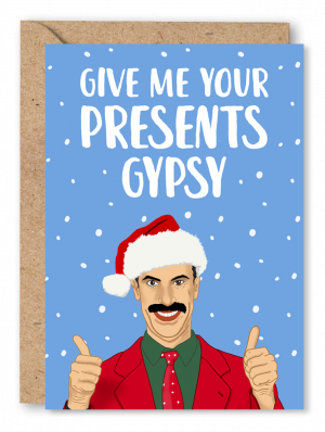 A light blue Christmas card featuring film character Borat with his thumbs up wearing a red and green Christmas suit and Santa hat on a snowy background alongside white text reading ‘Give me your presents Gypsy’