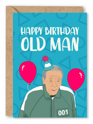 A blue Birthday card featuring an illustration of the Squid Game character ‘Old Man’ wearing a party hat with pink balloons in the background. White text above reads ‘Happy Birthday Old Man’