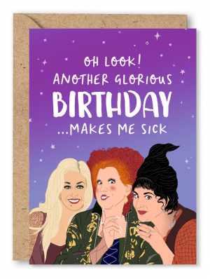 A Hocus Pocus Birthday card featuring an illustration of the three Hocus Pocus witches on a purple starry background. White text above reads ‘Oh look! Another glorious birthday… makes me sick’