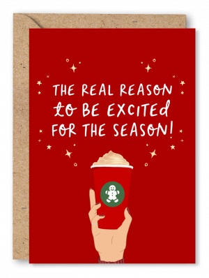 A red Christmas card featuring an illustration of a hand holding a Red Starbucks style coffee cup. White text above reads ‘The real reason to be excited for the season!’