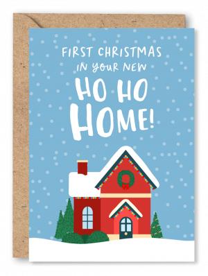 A blue Christmas card featuring an illustration of a red house, with snow on the roof and fairy lights strung below the rafters. White text above reads ‘First Christmas in your Ho Ho Home’